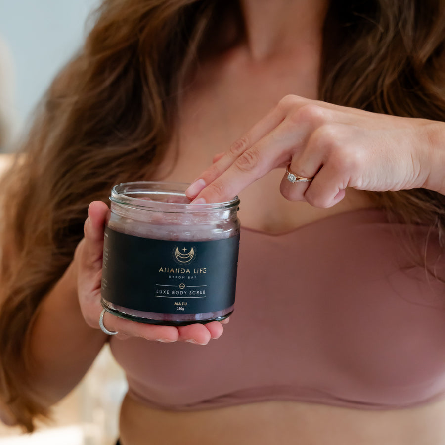 woman holding Mazu luxe body scrub natural exfoliating body scrub skincare – Ananda