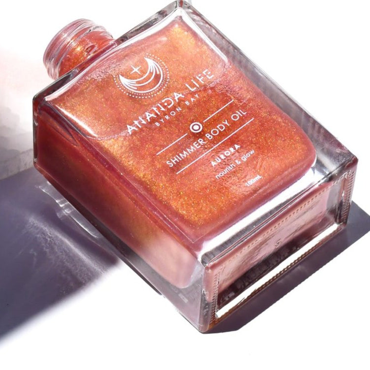 Aurora pink rose gold shimmer body oil natural glowing body oil highlighting skin – Ananda Life